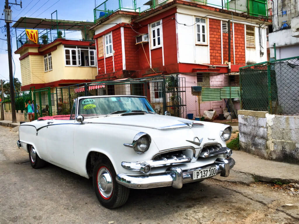 A white classic convertible in Havana. Discover picture perfect reasons to visit Cuba. Find out why it's become such a popular travel destination, and what you shouldn't miss when you're there! And for more travel tips and wanderlust inspiration follow The Scenic Suitcase on Pinterest!