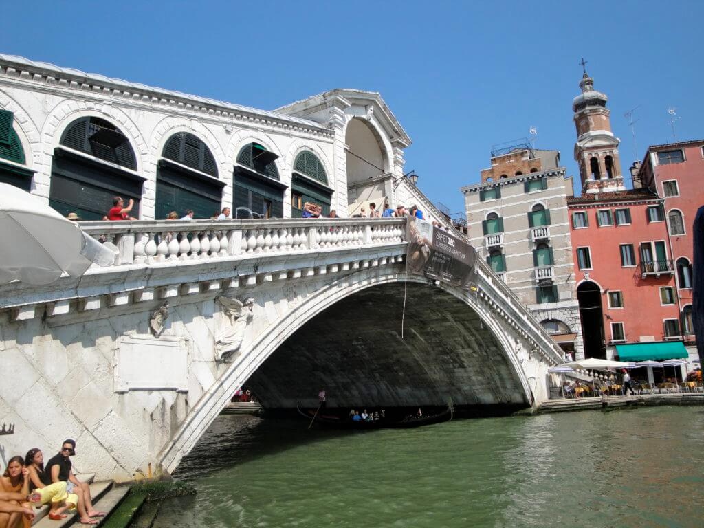 The Rialto Bridge in Venice. Discover 15 picture perfect reasons to visit Italy. And for more travel tips and wanderlust inspiration follow The Scenic Suitcase on Pinterest!