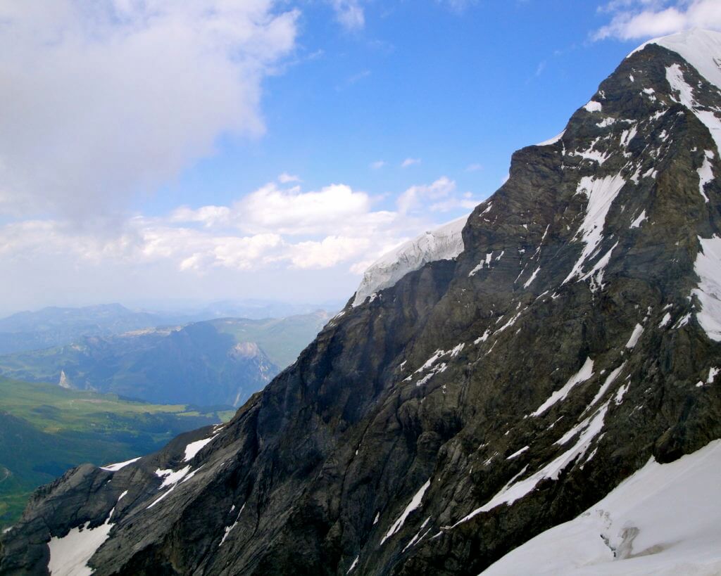 The top of the Eiger in the Jungfrau Region. A visit to Switzerland will have you feeling you just walked into The Sound of Music. Here are some sights and landmarks you absolutely shouldn't miss. And for more travel tips and wanderlust inspiration follow The Scenic Suitcase on Pinterest!