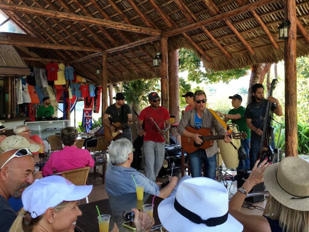 Musicians playing at a restaurant. Discover picture perfect reasons to visit Cuba. Find out why it's become such a popular travel destination, and what you shouldn't miss when you're there! And for more travel tips and wanderlust inspiration follow The Scenic Suitcase on Pinterest!
