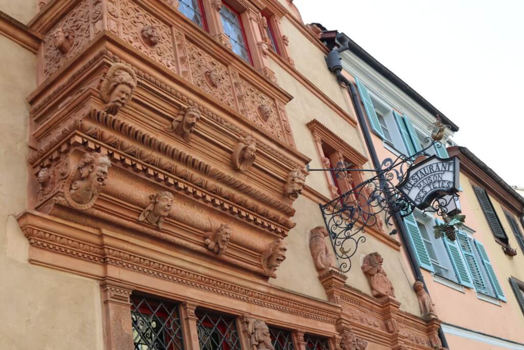 Maison des Tetes (House of the Heads). Discover 10 picture perfect reasons to visit Colmar, France. And for more travel tips and wanderlust inspiration follow The Scenic Suitcase on Pinterest!