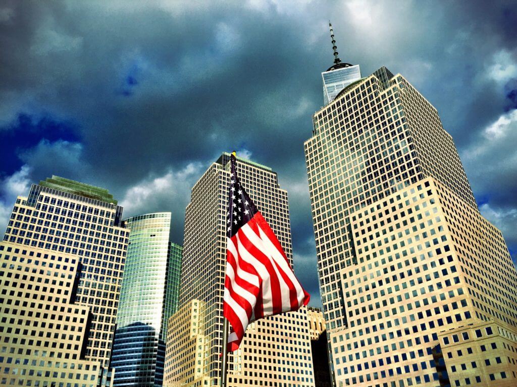 Skyscrapers and an American flag. Discover 30 picture perfect reasons to visit New York City. And for more travel tips and wanderlust inspiration follow The Scenic Suitcase on Pinterest!