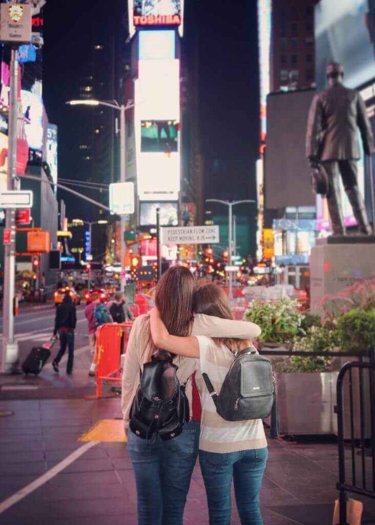 Friends in Times Square. Discover 30 picture perfect reasons to visit New York City. And for more travel tips and wanderlust inspiration follow The Scenic Suitcase on Pinterest!