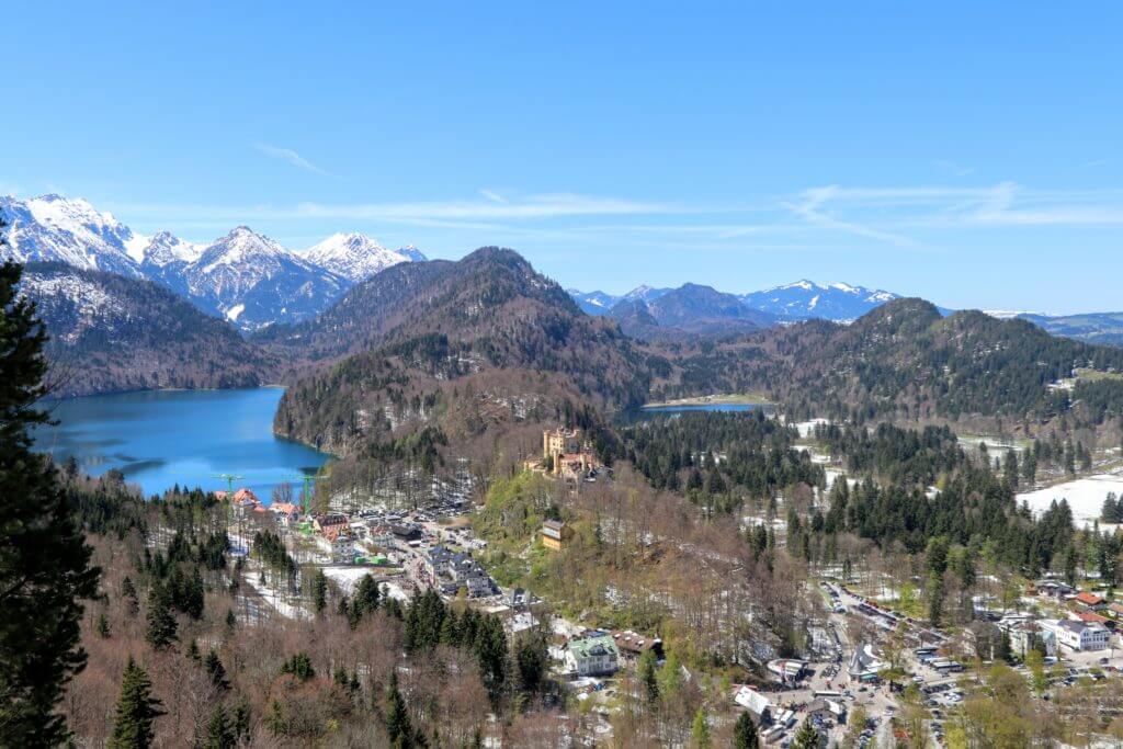 The Bavarian countryside outside Fussen with Castle Hohenschwangau in the distance. Discover 20 picture perfect reasons to visit Germany. Want even more wanderlust inspiration? Follow The Scenic Suitcase on Pinterest!