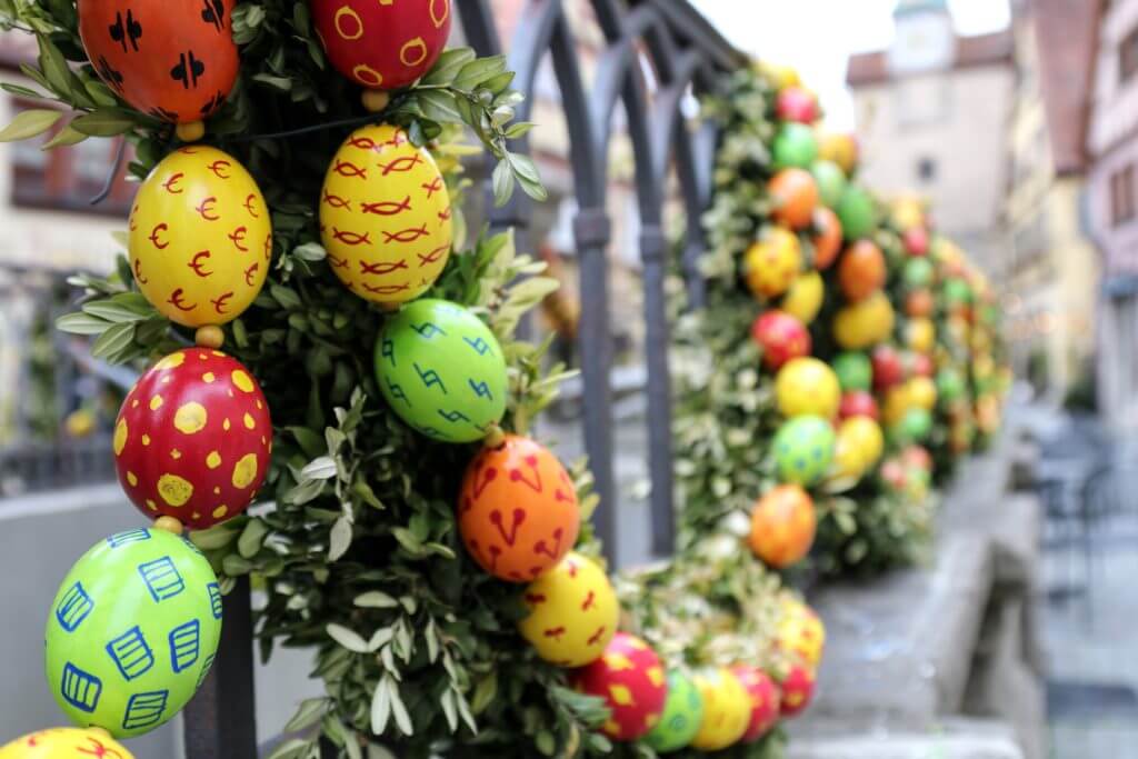 Easter eggs decorating a fountain in Rothenburg ob der Tauber. Discover 20 picture perfect reasons to visit Germany. Want even more wanderlust inspiration? Follow The Scenic Suitcase on Pinterest!