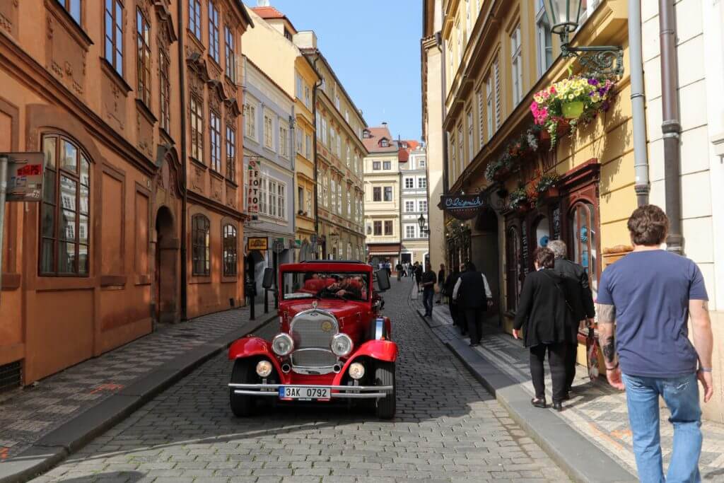 Cobblestone streets and an old fashion car. Discover 25 picture perfect reasons to visit Prague, Czech Republic. Want even more wanderlust inspiration? Follow The Scenic Suitcase on Pinterest!