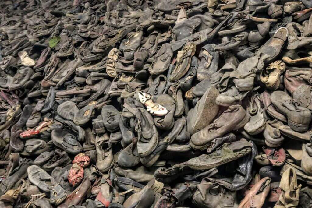 Shoes left by the victims of the Holocaust. The two most famous concentration camps in WWII - Auschwitz I & Auschwitz-Birkenau. Please note, this post contains graphic material. Discretion is advised. And for more travel tips and wanderlust inspiration follow The Scenic Suitcase on Pinterest!