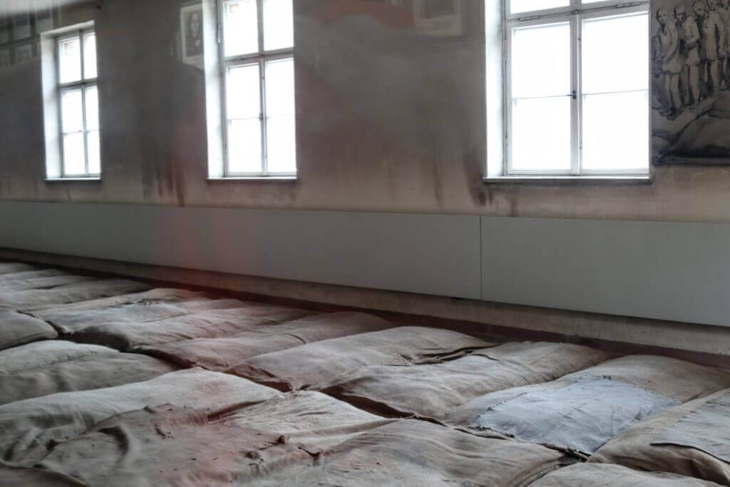Straw mattresses in an Auschwitz dorm. The two most famous concentration camps in WWII - Auschwitz I & Auschwitz-Birkenau. Please note, this post contains graphic material. Discretion is advised. And for more travel tips and wanderlust inspiration follow The Scenic Suitcase on Pinterest!