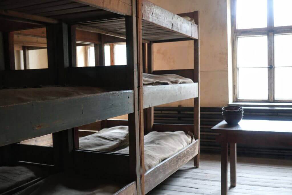 Bunk beds in Auschwitz. The two most famous concentration camps in WWII - Auschwitz I & Auschwitz-Birkenau. Please note, this post contains graphic material. Discretion is advised. And for more travel tips and wanderlust inspiration follow The Scenic Suitcase on Pinterest!