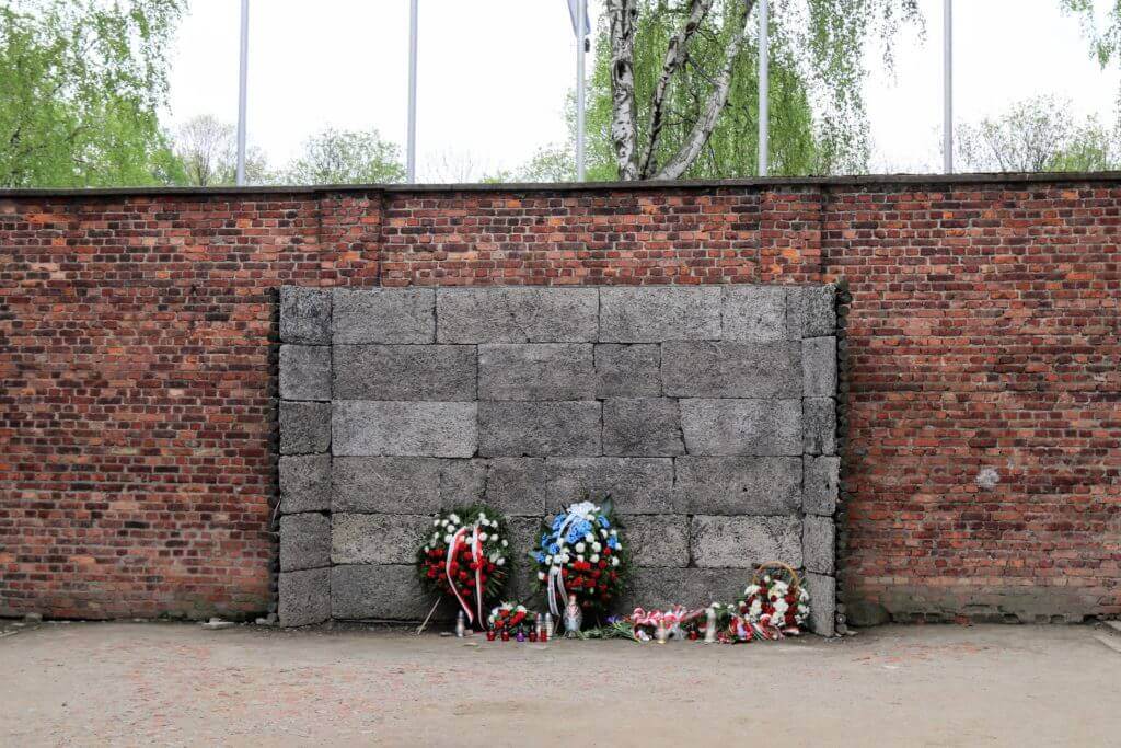 The Black Wall where victims were executed within Auschwitz. The two most famous concentration camps in WWII - Auschwitz I & Auschwitz-Birkenau. Please note, this post contains graphic material. Discretion is advised. And for more travel tips and wanderlust inspiration follow The Scenic Suitcase on Pinterest!