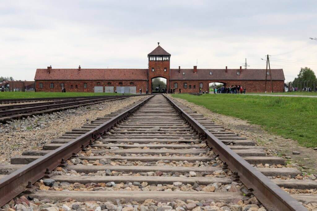 The railroad entrance to Auschwitz-Birkenau. The two most famous concentration camps in WWII - Auschwitz I & Auschwitz-Birkenau. Please note, this post contains graphic material. Discretion is advised. And for more travel tips and wanderlust inspiration follow The Scenic Suitcase on Pinterest!