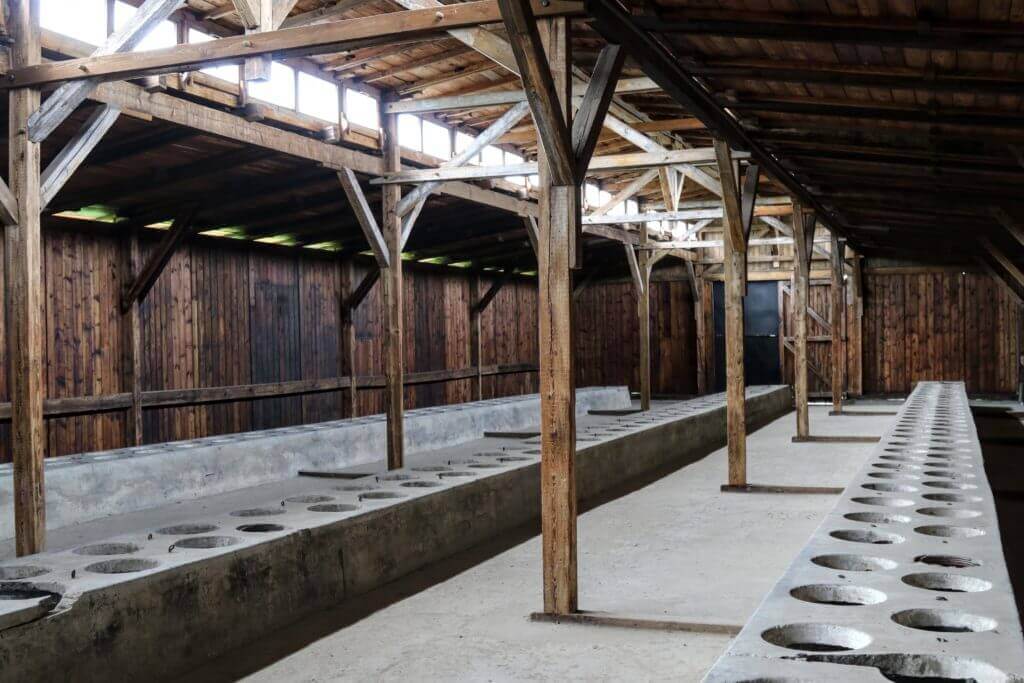 A bathroom in Auschwitz-Birkenau. The two most famous concentration camps in WWII - Auschwitz I & Auschwitz-Birkenau. Please note, this post contains graphic material. Discretion is advised. And for more travel tips and wanderlust inspiration follow The Scenic Suitcase on Pinterest!