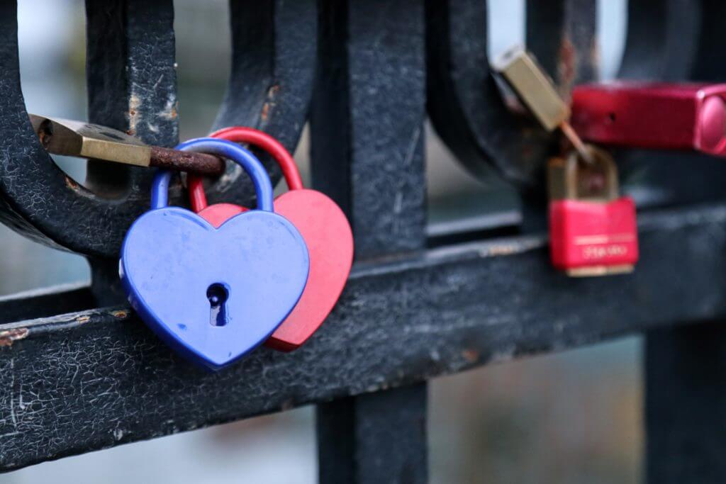 Love locks along a bridge on the Nyhavn Canal. Discover 12 picture perfect reasons to visit Copenhagen, Denmark. Want even more wanderlust inspiration? Follow The Scenic Suitcase on Pinterest!
