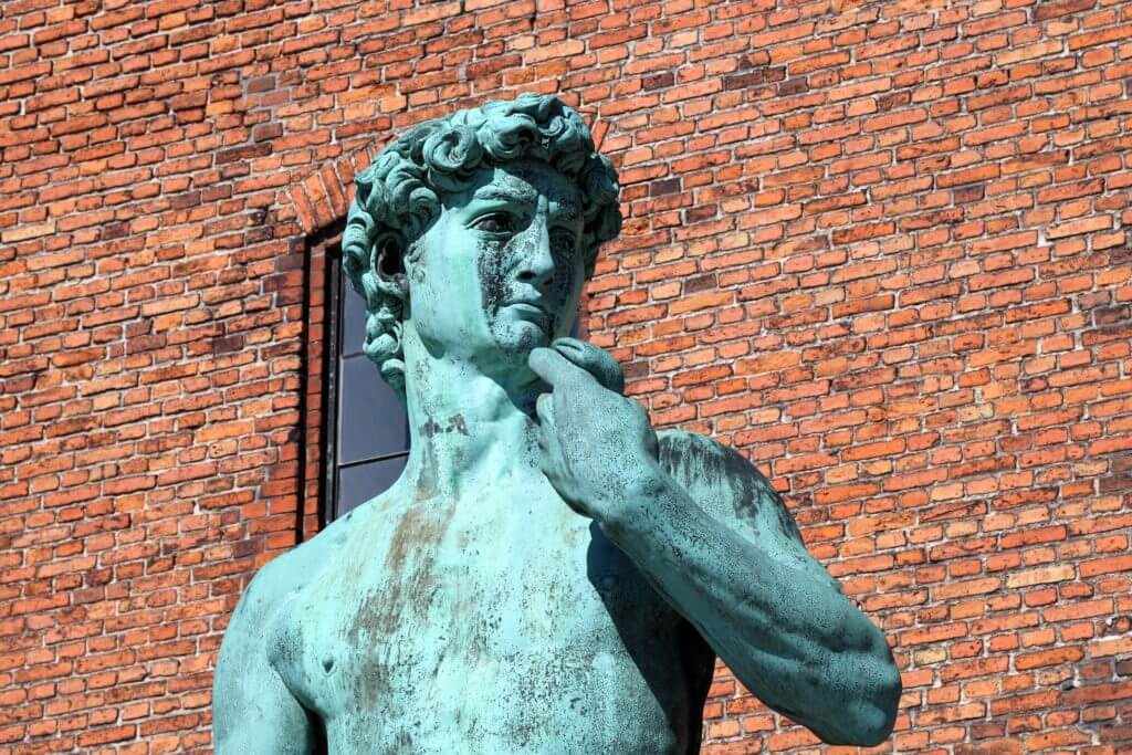 A replica statue of Michelangelo's "David". Discover 12 picture perfect reasons to visit Copenhagen, Denmark. Want even more wanderlust inspiration? Follow The Scenic Suitcase on Pinterest!