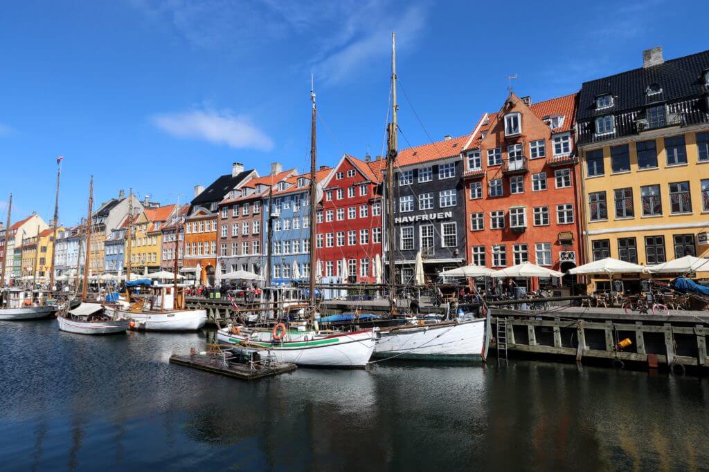 The Nyhavn Canal. Discover 12 picture perfect reasons to visit Copenhagen, Denmark. Want even more wanderlust inspiration? Follow The Scenic Suitcase on Pinterest!