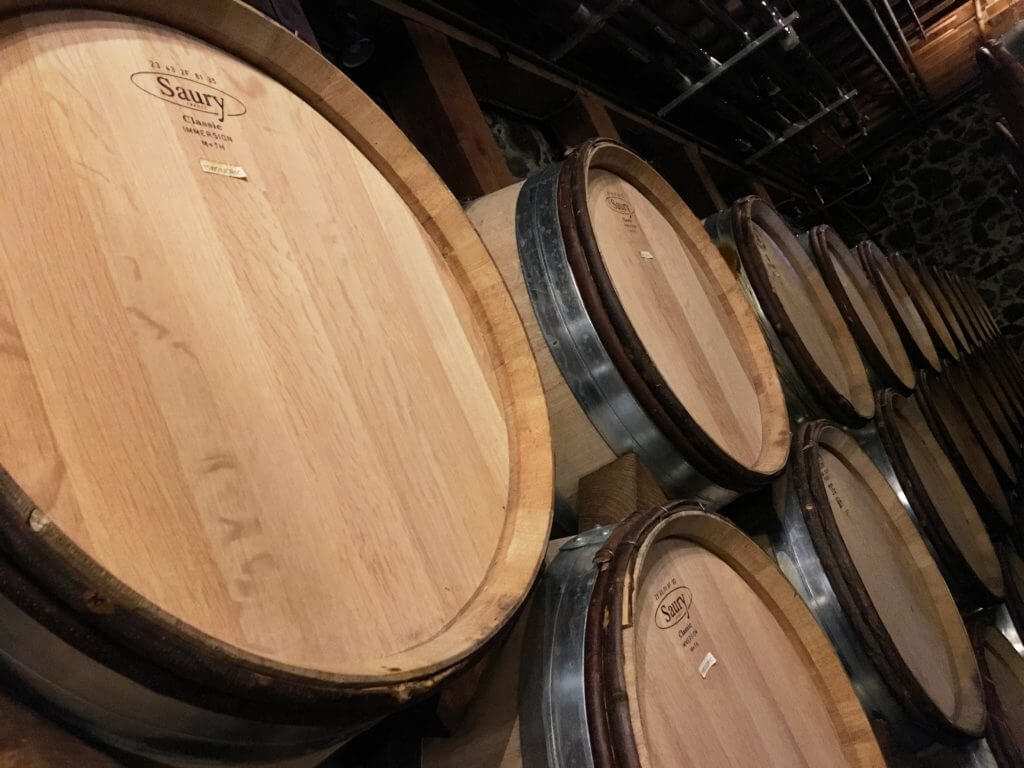 Wine barrels stacked in the wine caves. Discover 15 picture perfect reasons to visit Napa, California - one of the most famous wine regions in the world. And for more travel tips and wanderlust inspiration follow The Scenic Suitcase on Pinterest!