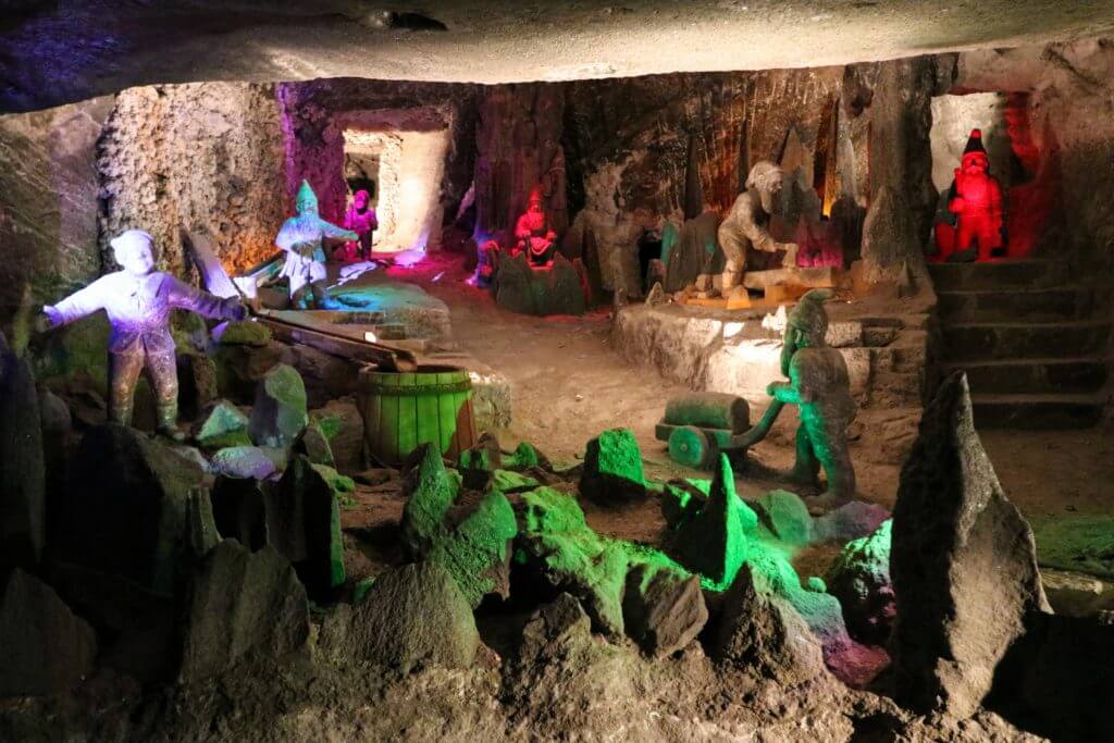 Working gnomes carved out of salt. The Wieliczka Salt Mine in Poland is a marvel 12 million years in the making. Discover what makes this salty wonderland worthy of a UNESCO designation. For more travel tips and wanderlust inspiration follow The Scenic Suitcase on Pinterest!