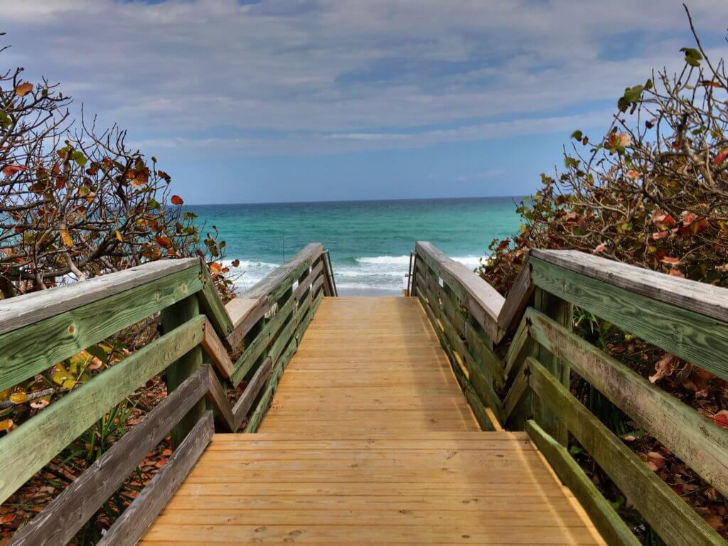A boardwalk staircaase to the ocean. Discover 12 picture perfect reasons to visit Florida. And for more travel tips and wanderlust inspiration follow The Scenic Suitcase on Pinterest!