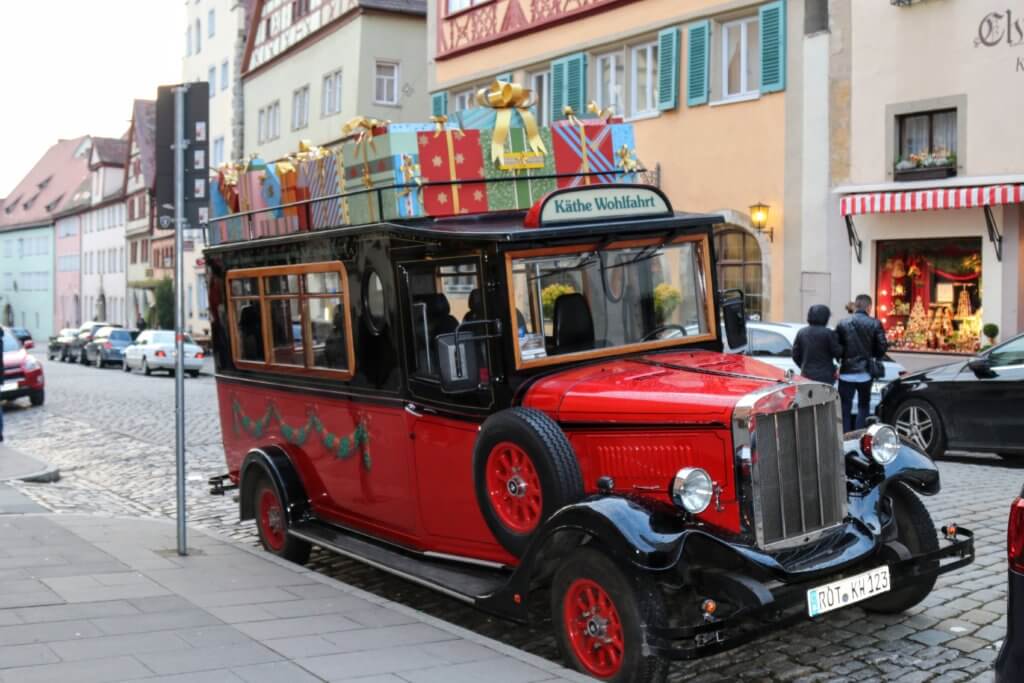 An old-fashioned station wagon filled with Christmas presents in Rothenberg ob der Tauber. Discover 5 of Europe's most charming villages! And for more travel tips and wanderlust inspiration, follow The Scenic Suitcase on Pinterest!