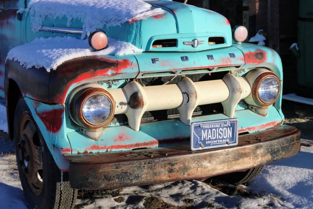 A snow covered classic ford truck. Discover 22 picture perfect reasons to visit Bozeman, Montana. And for more travel tips and wanderlust inspiration follow The Scenic Suitcase on Pinterest!