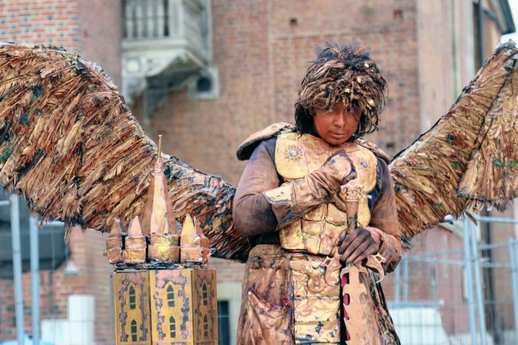 An angelic street performer near St. Mary's Basilica in the main market square. Just one of the many reasons to visit Krakow, Poland. For more travel tips and wanderlust inspiration follow The Scenic Suitcase on Pinterest!