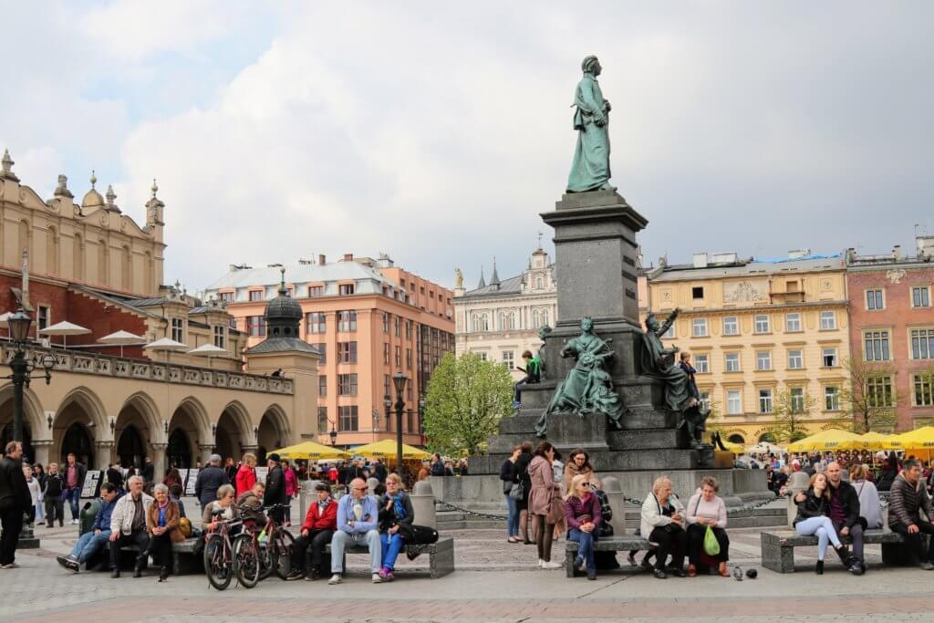 The main market square near St. Mary's Basilica. Just one of the many reasons to visit Krakow, Poland. For more travel tips and wanderlust inspiration follow The Scenic Suitcase on Pinterest!