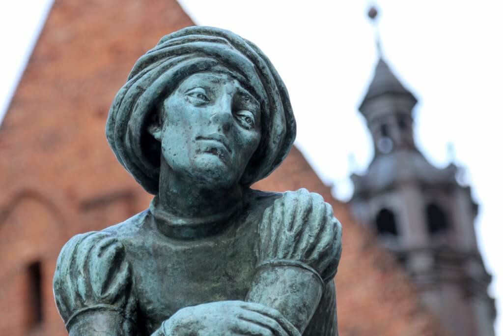 A bronze statue near St. Mary's Basilica in the main market square. Just one of the many reasons to visit Krakow, Poland. For more travel tips and wanderlust inspiration follow The Scenic Suitcase on Pinterest!