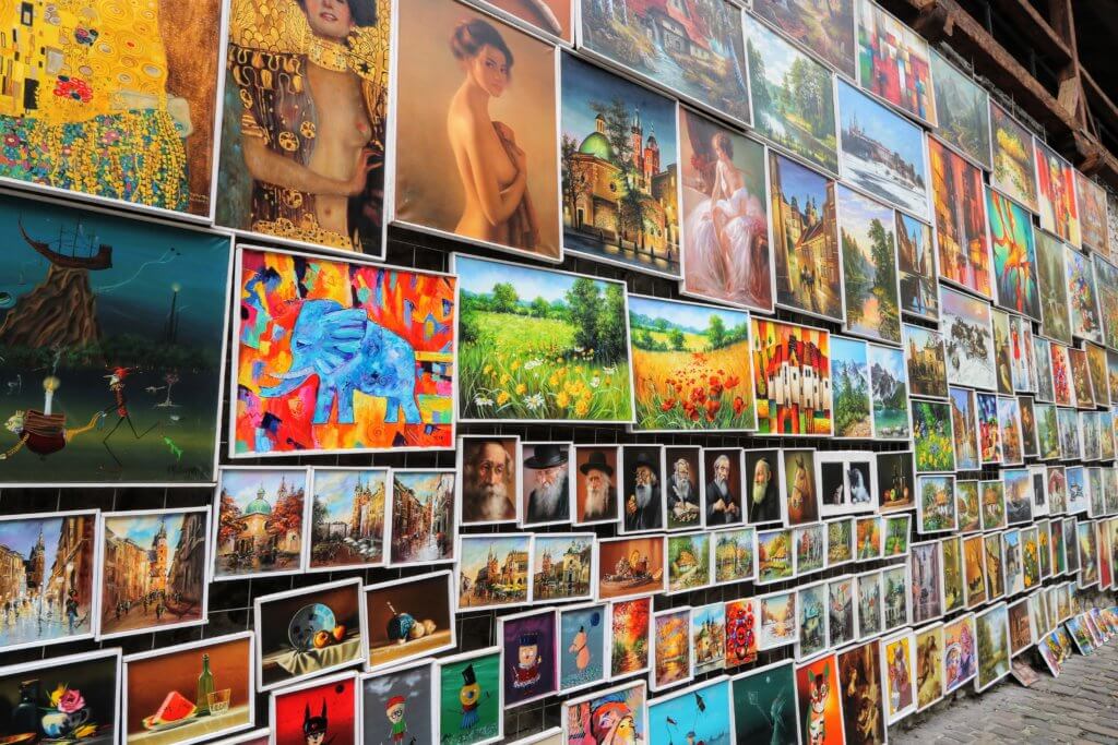 Colorful artistic renderings near St. Florian's Gate. Just one of the many reasons to visit Krakow, Poland. For more travel tips and wanderlust inspiration follow The Scenic Suitcase on Pinterest!