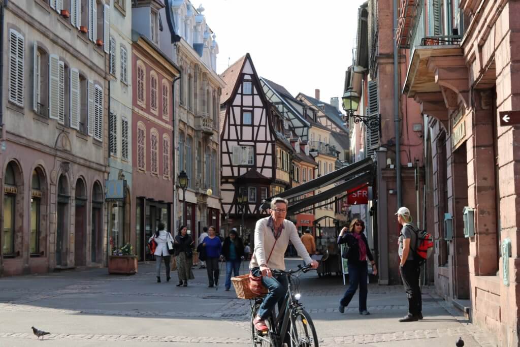 A picturesque street in Colmar, France. Discover 5 of Europe's most charming villages! And for more travel tips and wanderlust inspiration, follow The Scenic Suitcase on Pinterest!