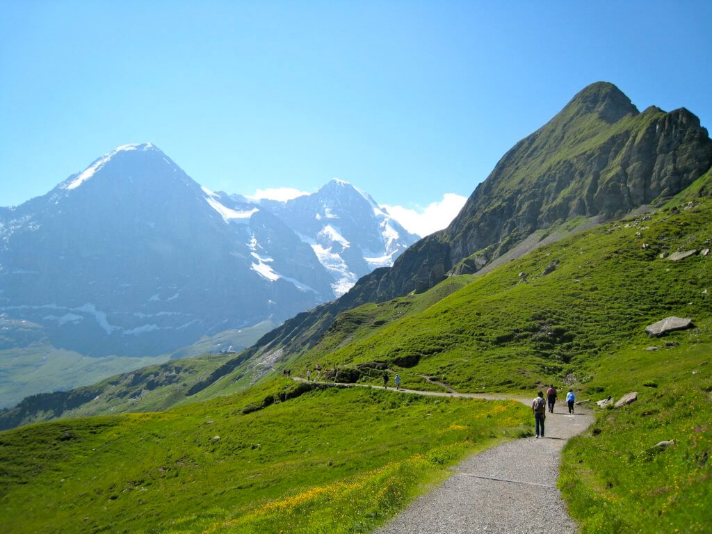 The Mannlichen trail above Wengen in the Swiss Alps. Discover 5 of Europe's most charming villages! And for more travel tips and wanderlust inspiration, follow The Scenic Suitcase on Pinterest!