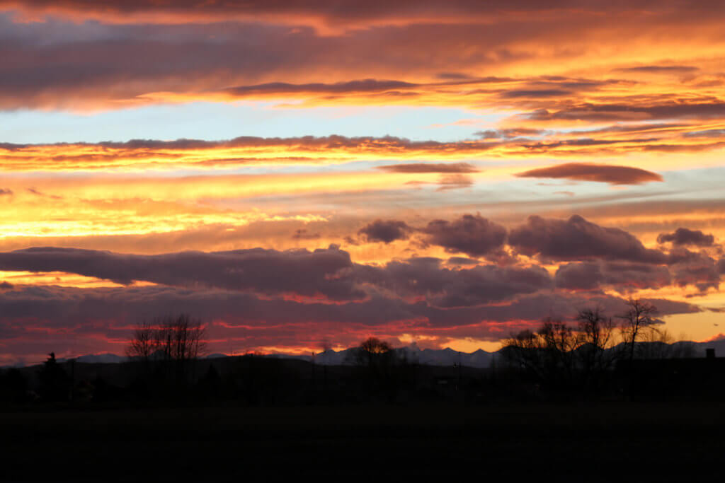 A beautiful orange and purple sunset over the mountains. Discover 22 picture perfect reasons to visit Bozeman, Montana. And for more travel tips and wanderlust inspiration follow The Scenic Suitcase on Pinterest!
