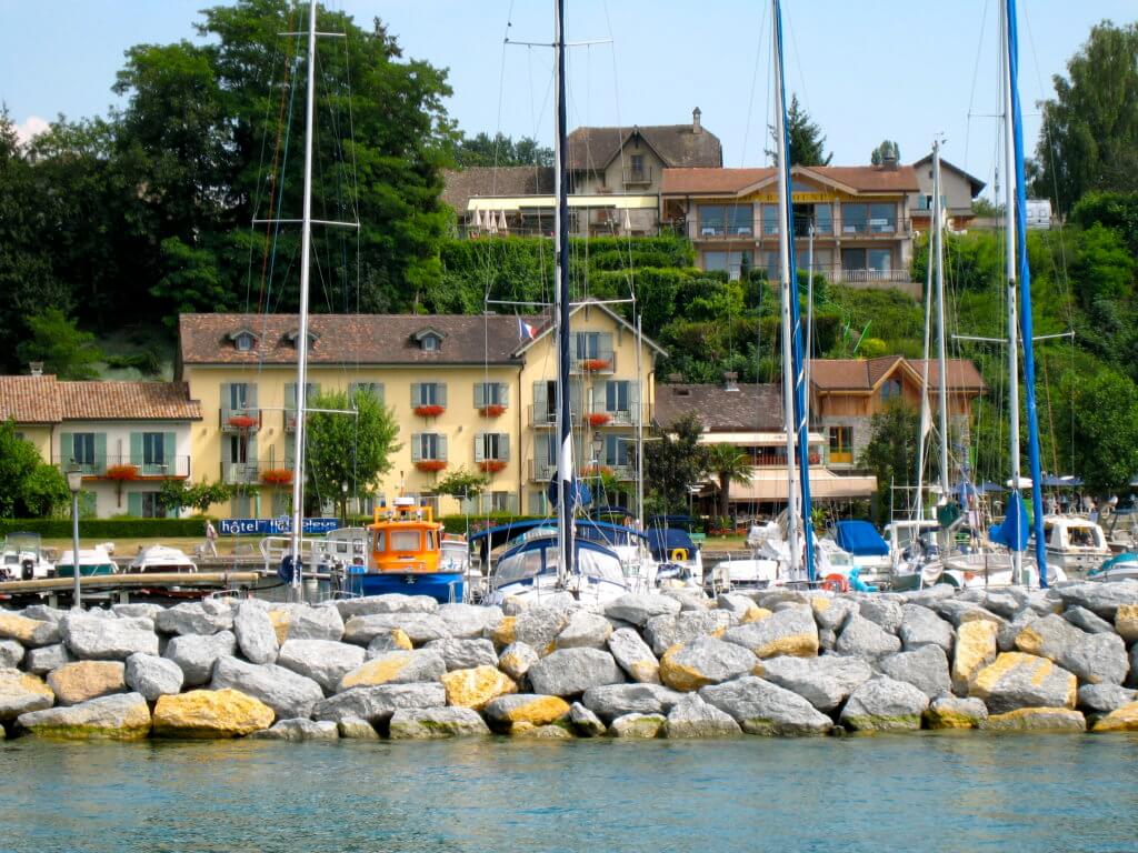 Sailboats on Lake Geneva in Yvoire, France. Discover 5 of Europe's most charming villages! And for more travel tips and wanderlust inspiration, follow The Scenic Suitcase on Pinterest!
