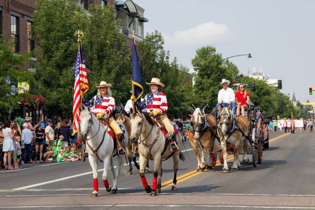 Flags and horses in a parade down Main Street. Discover 22 picture perfect reasons to visit Bozeman, Montana. And for more travel tips and wanderlust inspiration follow The Scenic Suitcase on Pinterest!