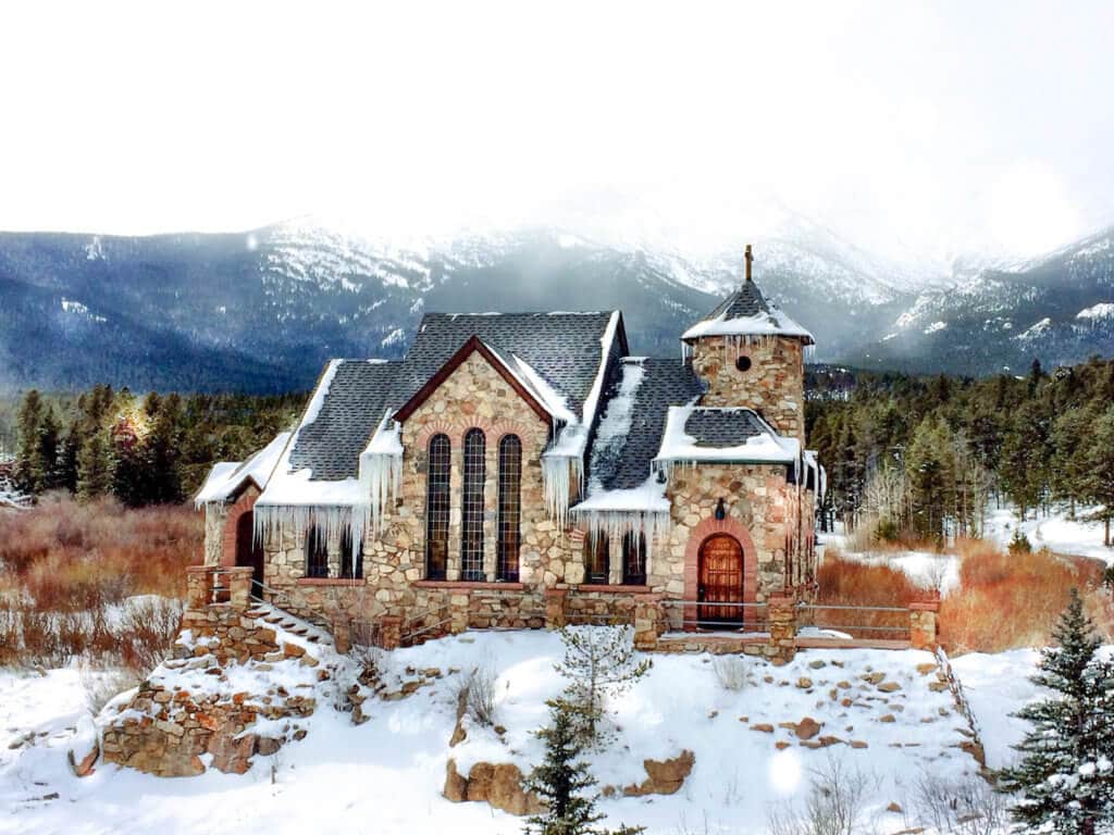 Chapel on the Rock. An icy church with snowcapped mountains in the background. Discover 20 picture perfect reasons to visit Colorado in winter. And for more travel tips and wanderlust inspiration follow The Scenic Suitcase on Pinterest!