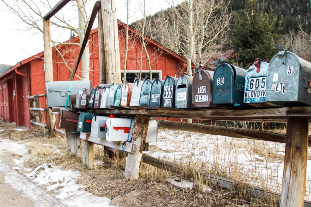 A row of mailboxes in the snow. Discover 20 picture perfect reasons to visit Colorado in winter. And for more travel tips and wanderlust inspiration follow The Scenic Suitcase on Pinterest!