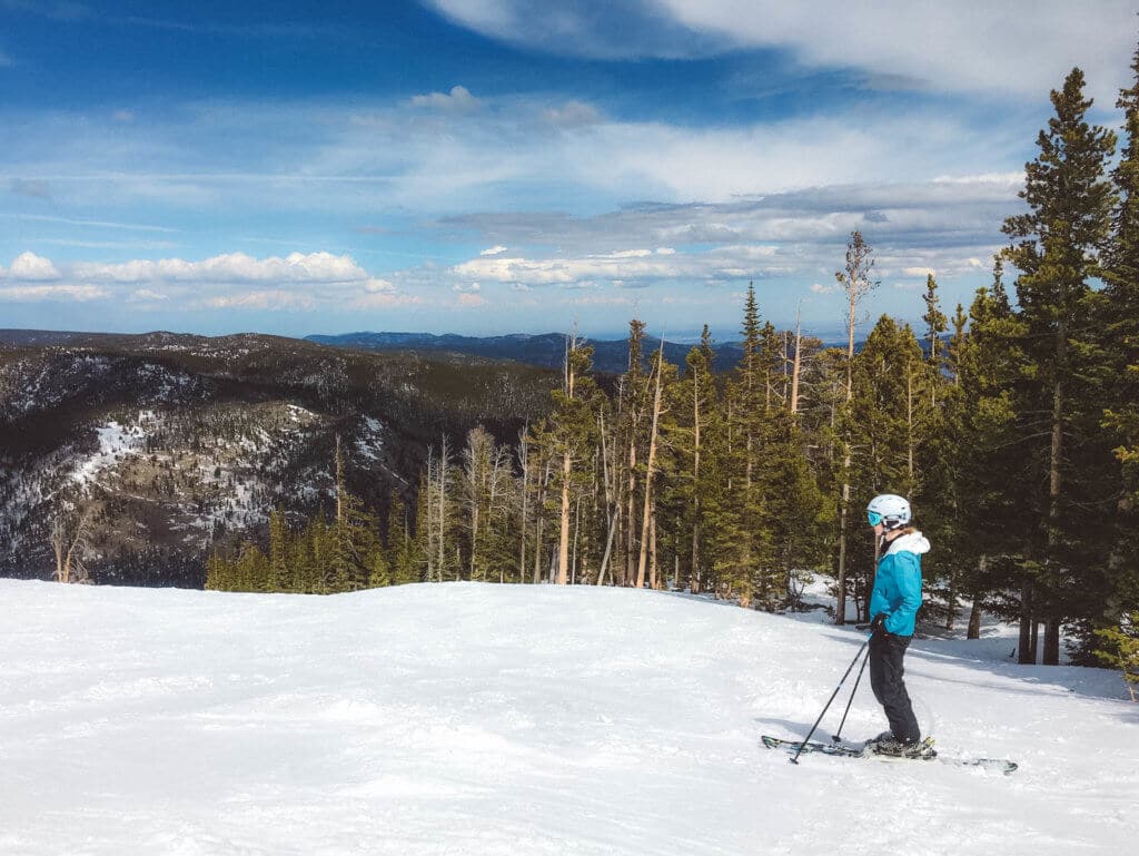 Skiing on a beautiful bluebird day. Discover 20 picture perfect reasons to visit Colorado in winter. And for more travel tips and wanderlust inspiration follow The Scenic Suitcase on Pinterest!