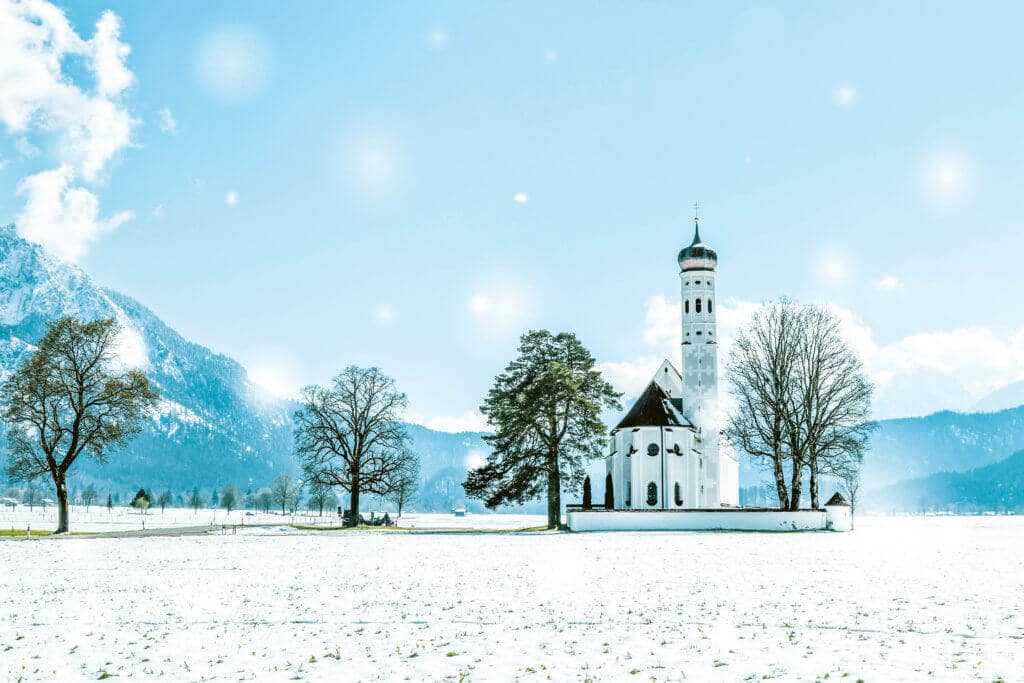 A snowy St. Coloman near Fussen. Discover 20 picture perfect reasons to visit Germany. Want even more wanderlust inspiration? Follow The Scenic Suitcase on Pinterest!