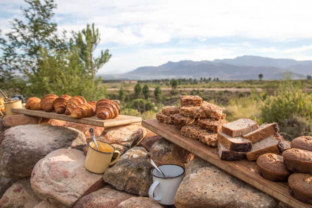 Campfire breakfast along a stone wall. Find out why attending The Blonde Abroad photography tour is a once-in-a-lifetime experience you shouldn't miss. And for more travel tips and wanderlust inspiration, follow The Scenic Suitcase on Pinterest!