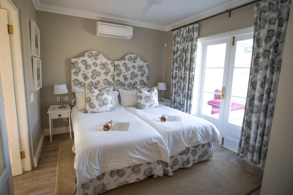 A cottage room at the Boschandal Winery in South Africa. Find out why attending The Blonde Abroad photography tour is a once-in-a-lifetime experience you shouldn't miss. And for more travel tips and wanderlust inspiration, follow The Scenic Suitcase on Pinterest!