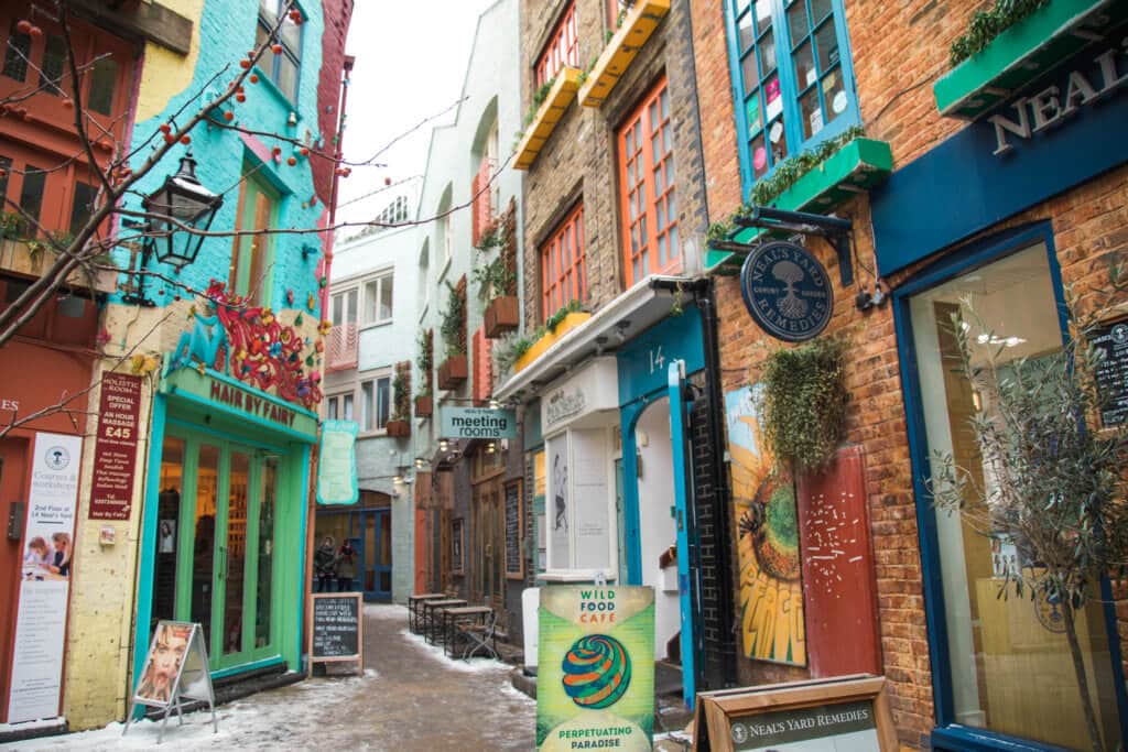 Colorful building exteriors in Neal's Yard. There are countless reasons to visit London. With captivating museums, enticing architecture, and a myriad of activities it's hard to know what to see first. Here are a few things you shouldn't miss. And for more travel tips and wanderlust inspiration follow The Scenic Suitcase on Pinterest!