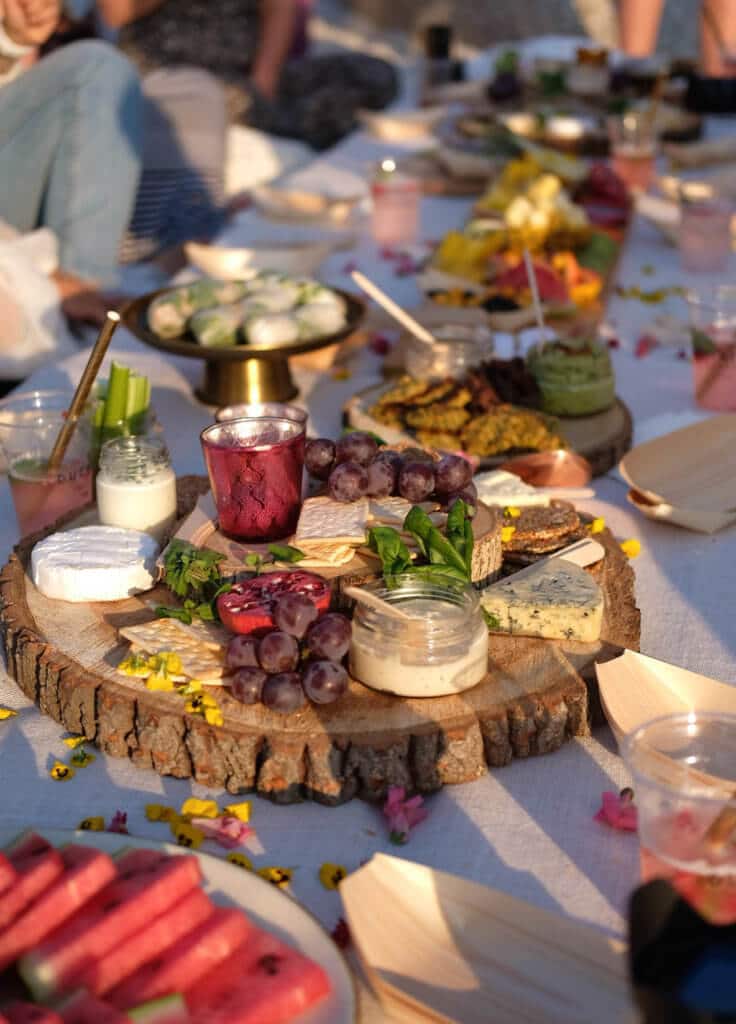 Cheese, spreads, and fruit at a beach picnic. Find out why attending The Blonde Abroad's photography retreat is a once-in-a-lifetime experience you shouldn't miss. And for more travel tips and wanderlust inspiration, follow The Scenic Suitcase on Pinterest!