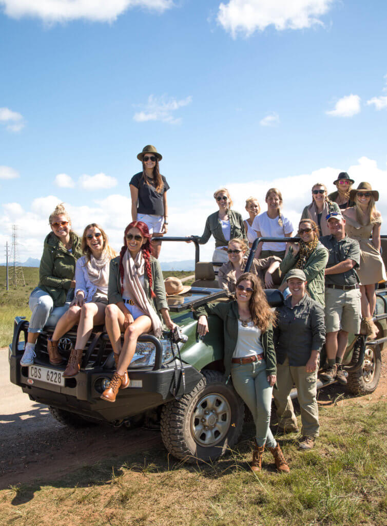 Group of girls around a safari truck. Find out why attending The Blonde Abroad photography tour is a once-in-a-lifetime experience you shouldn't miss. And for more travel tips and wanderlust inspiration, follow The Scenic Suitcase on Pinterest!