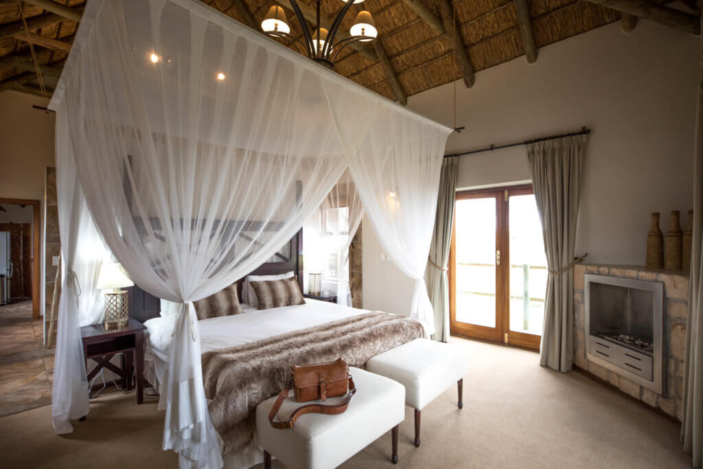 A beautiful bedroom at a villa in the Gondwana Game Reserve. Find out why attending The Blonde Abroad photography tour is a once-in-a-lifetime experience you shouldn't miss. And for more travel tips and wanderlust inspiration, follow The Scenic Suitcase on Pinterest!
