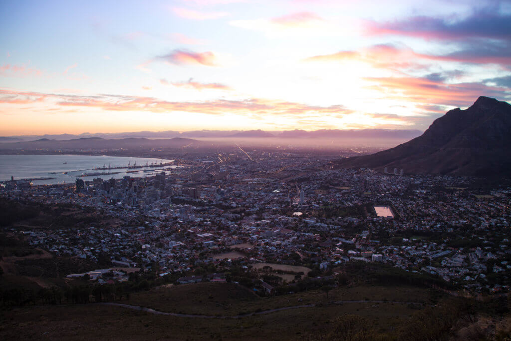 Sunrise from the top of Lionshead. There are a million reasons to visit South Africa. The country is as diverse as it is beautiful and offers countless activities and bucket list adventures. Find out what you can't miss! And for more travel tips and wanderlust inspiration follow The Scenic Suitcase on Pinterest!