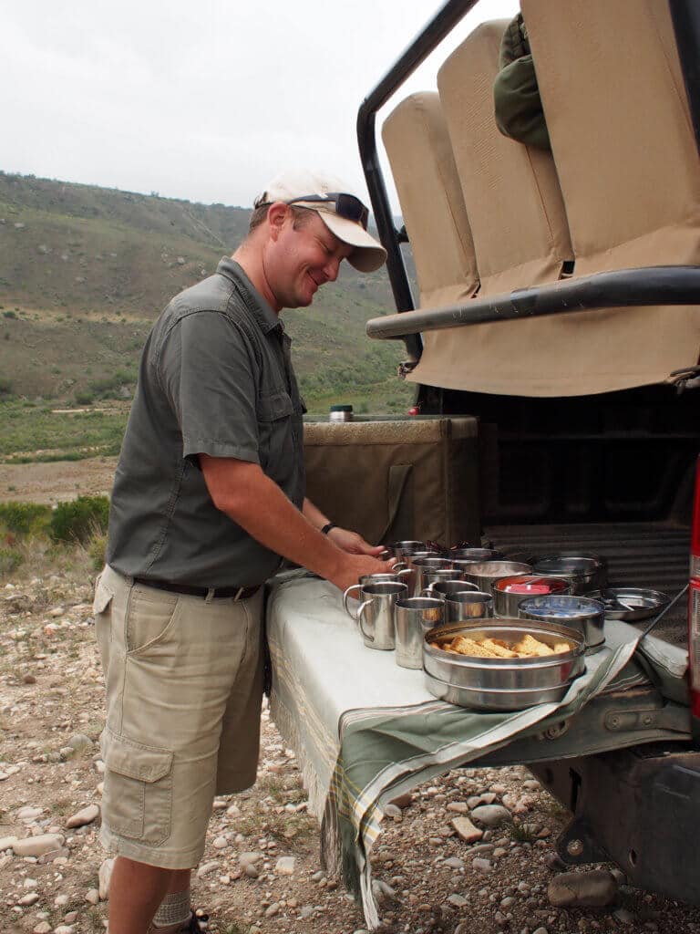 A park ranger making hot chocolate and coffee on the back of a safari vehicle. An African safari at the Gondwana Game Reserve should be at the top of your bucket list! From luxuriously appointed rooms to stunning wildlife, it's an experience everyone should have when visiting South Africa. And for more travel tips and wanderlust inspiration, follow The Scenic Suitcase on Pinterest!