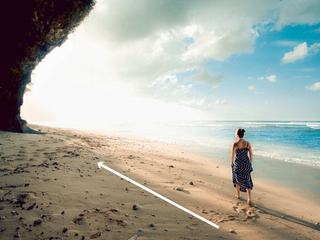A girl walking towards sunrise along the shoreline. Using these travel photography composition tips, your images will look just as astounding as the places you visit! Discover all you need to know for jaw-dropping photos! And for more travel tips and wanderlust inspiration follow The Scenic Suitcase on Pinterest!