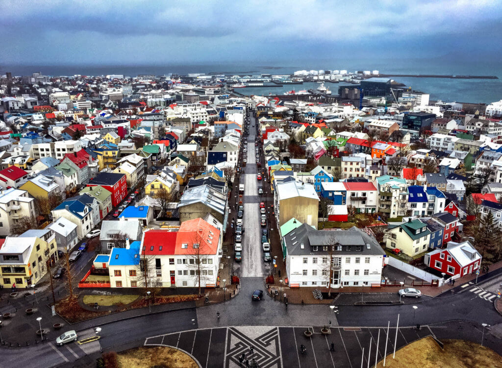 Colorful rooftops of the city of Reykjavik, Iceland. Discover 20 of the most iconic photo locations in the world, with links to a map of where you can find them! And for more wanderlust inspiration and travel tips, follow The Scenic Suitcase on Pinterest!