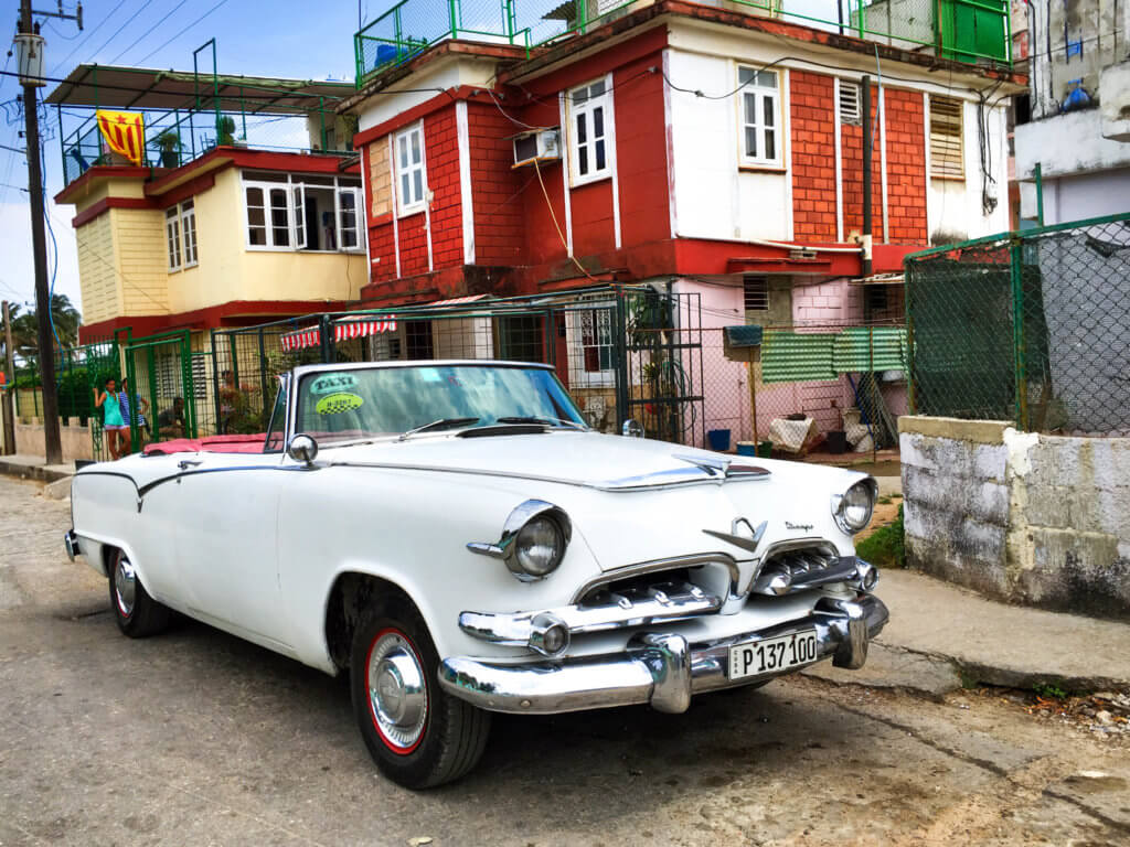 A classic white convertible in front of a colorful building in Cuba. Discover 20 of the most iconic photo locations in the world, with links to a map of where you can find them! And for more wanderlust inspiration and travel tips, follow The Scenic Suitcase on Pinterest!