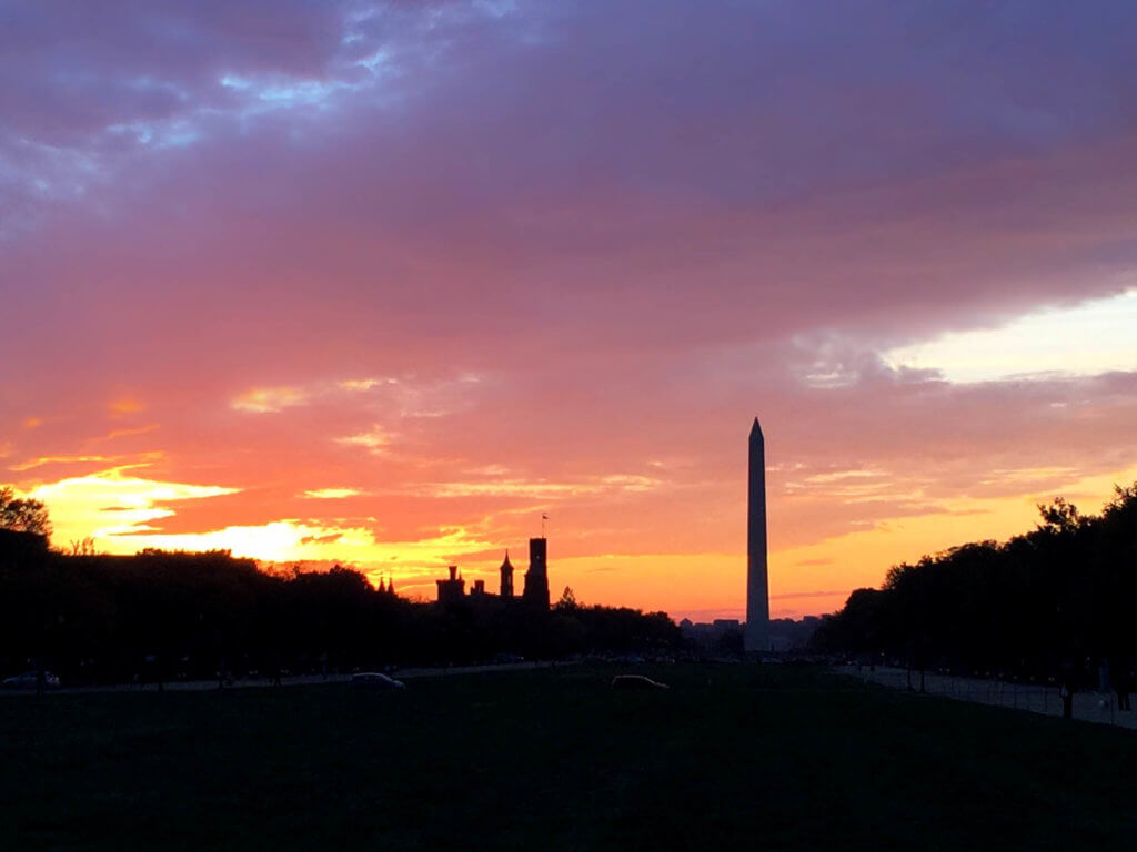Sunset over the National Mall with the Washington Monument in the background. Whether it's the Statue of Liberty, Washington DC, or a quaint hometown parade, these americana images capture the essence of the good ol' U.S.A. And for more travel tips and wanderlust inspiration, follow The Scenic Suitcase on Pinterest!