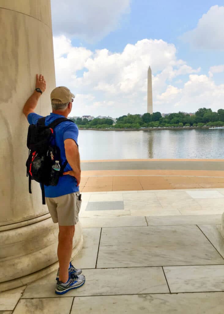 A man looking out at the Washington Monument from the Lincoln Memorial steps. Whether it's the Statue of Liberty, Washington DC, or a quaint hometown parade, these americana images capture the essence of the good ol' U.S.A. And for more travel tips and wanderlust inspiration, follow The Scenic Suitcase on Pinterest!